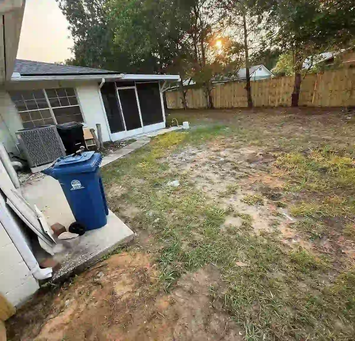 Backyard after Haul & Gone cleanout: clear lawn, all debris removed