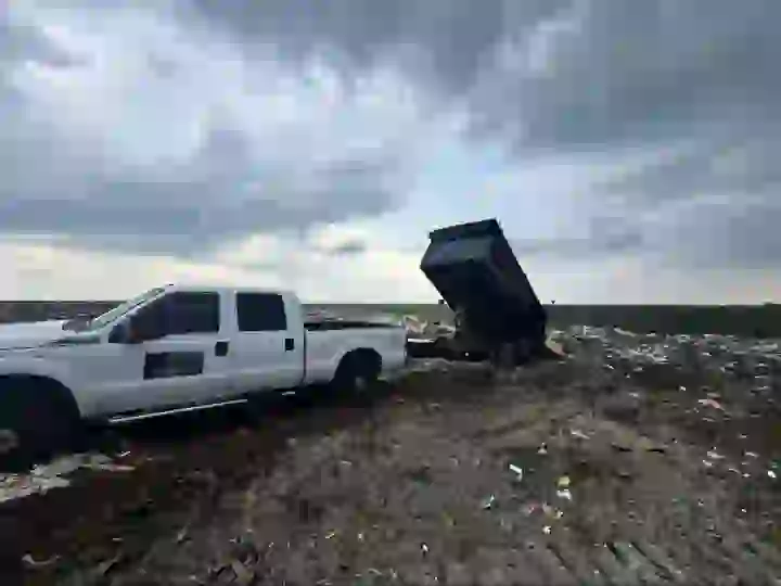 Haul & Gone dump trailer unloading at the disposal site
